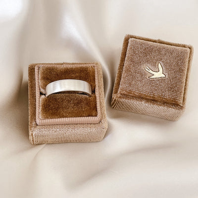 A sterling silver Signature Men's Ring in a velvet Bluebird Co ring box.
